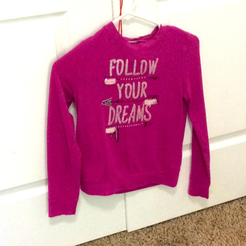 A pink long sleeve shirt